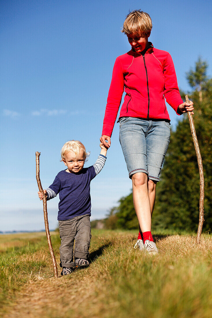 Mother and son (2 years) hiking, Haide, Ummanz, Island of Ruegen, Mecklenburg-Western Pomerania, Germany