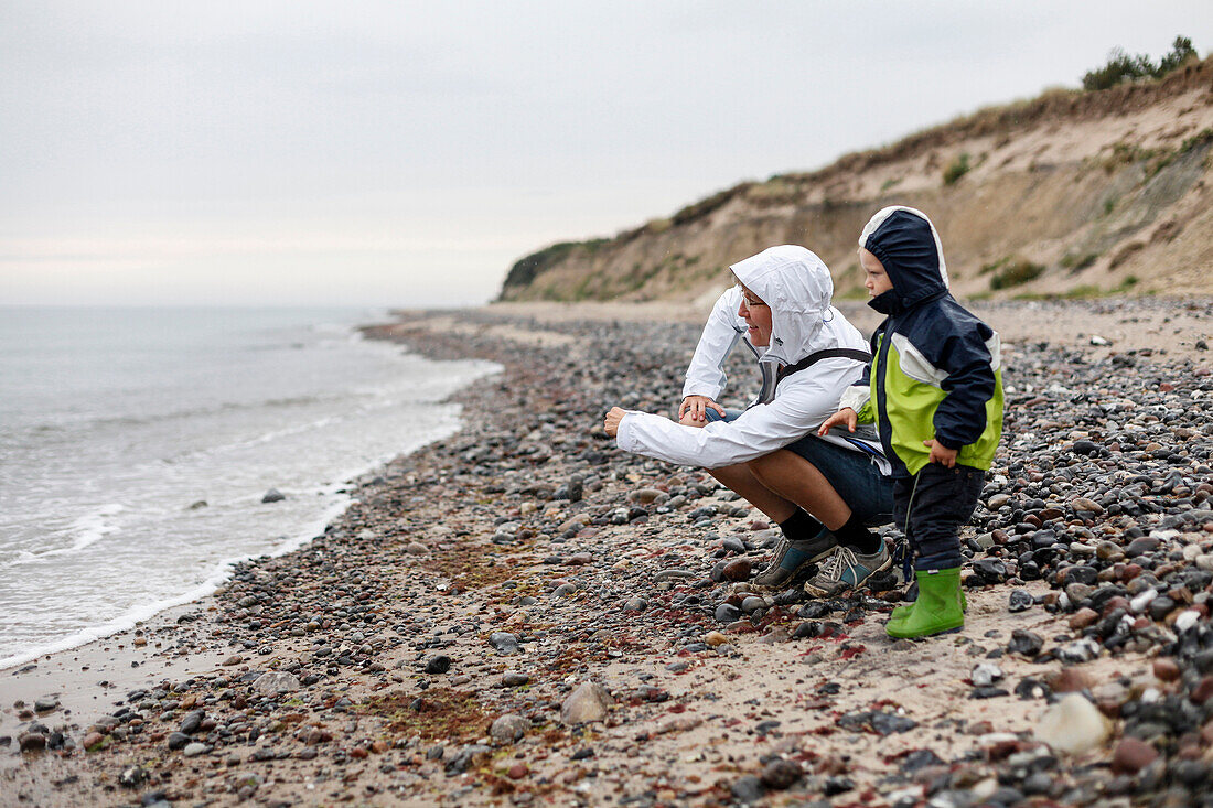 Mother and son (2 years) playing at Baltic Sea beach, Bakenberg, Wittow Peninsula, Island of Ruegen, Mecklenburg-Western Pomerania, Germany