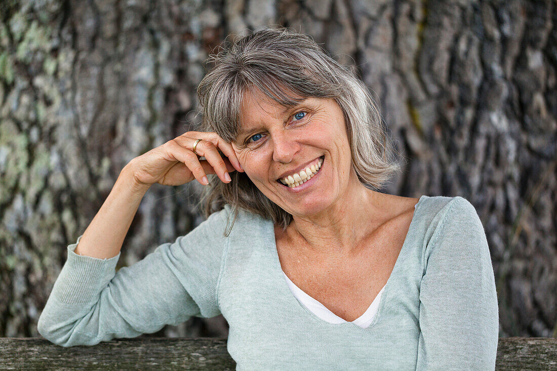 Woman smiling at camera, Bavaria, Germany