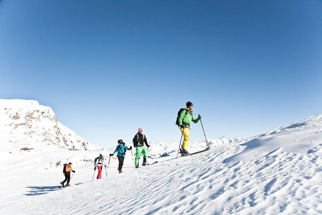 Group of ski tourers ascending, Zinal, Anniviers, Canton of Valais, Switzerland