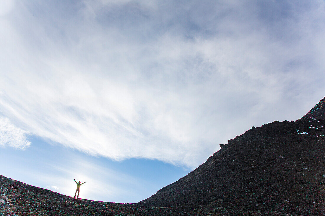 Man on the ridge of mount Kreuzspitze, Johannis Hut, Virgen Valley, Tyrol, Austria