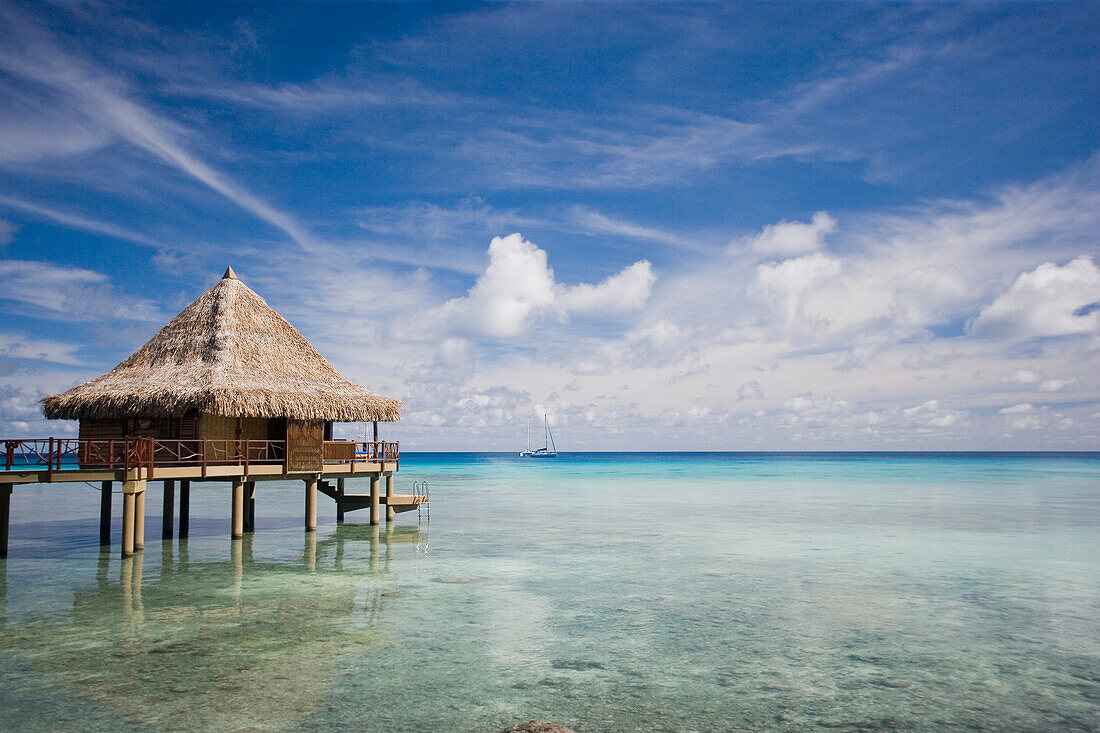 French Polynesia, Moorea Lagoon Resort, Bungalows over beautiful turquoise ocean.