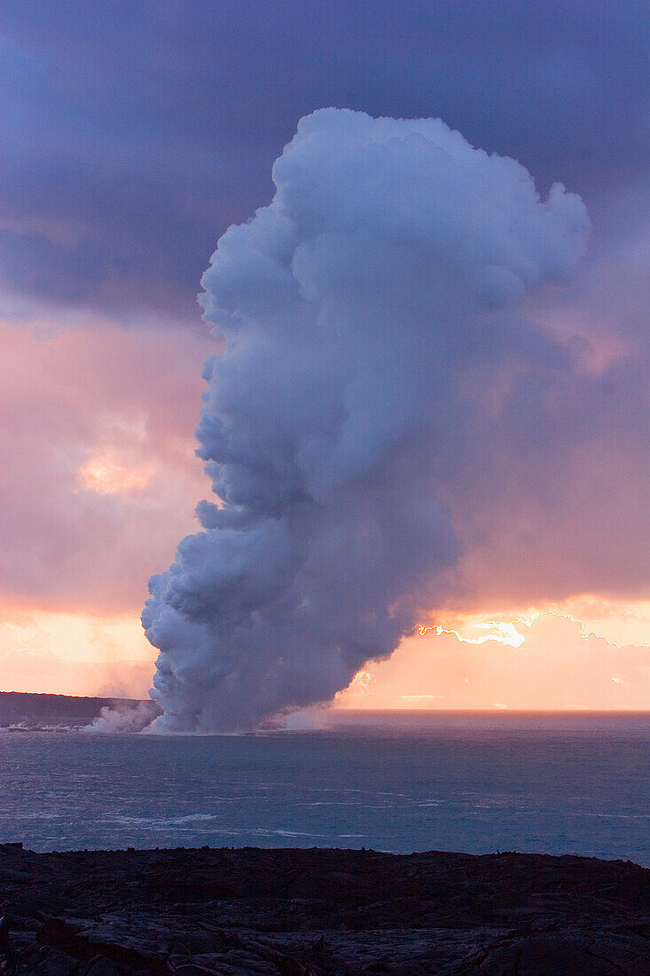 Hawaii, Big Island, Kalapana, White steam cloud from lava entering Pacific Ocean from Kilauea.