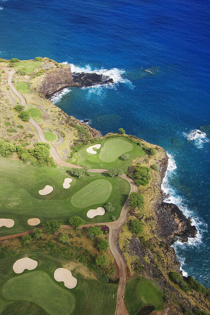 Hawaii, Lanai, Manele golf course along coastline, aerial.