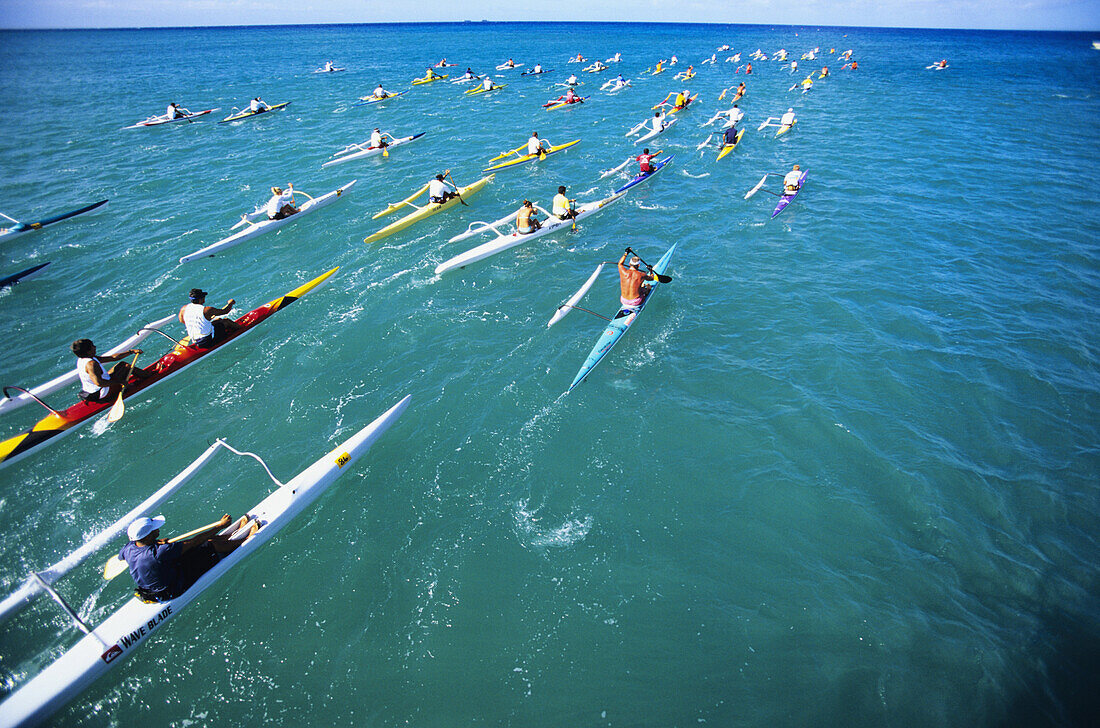 Hawaii, Oahu, Paddlers race one and two-man outrigger canoes in open ocean. NO MODEL RELEASE