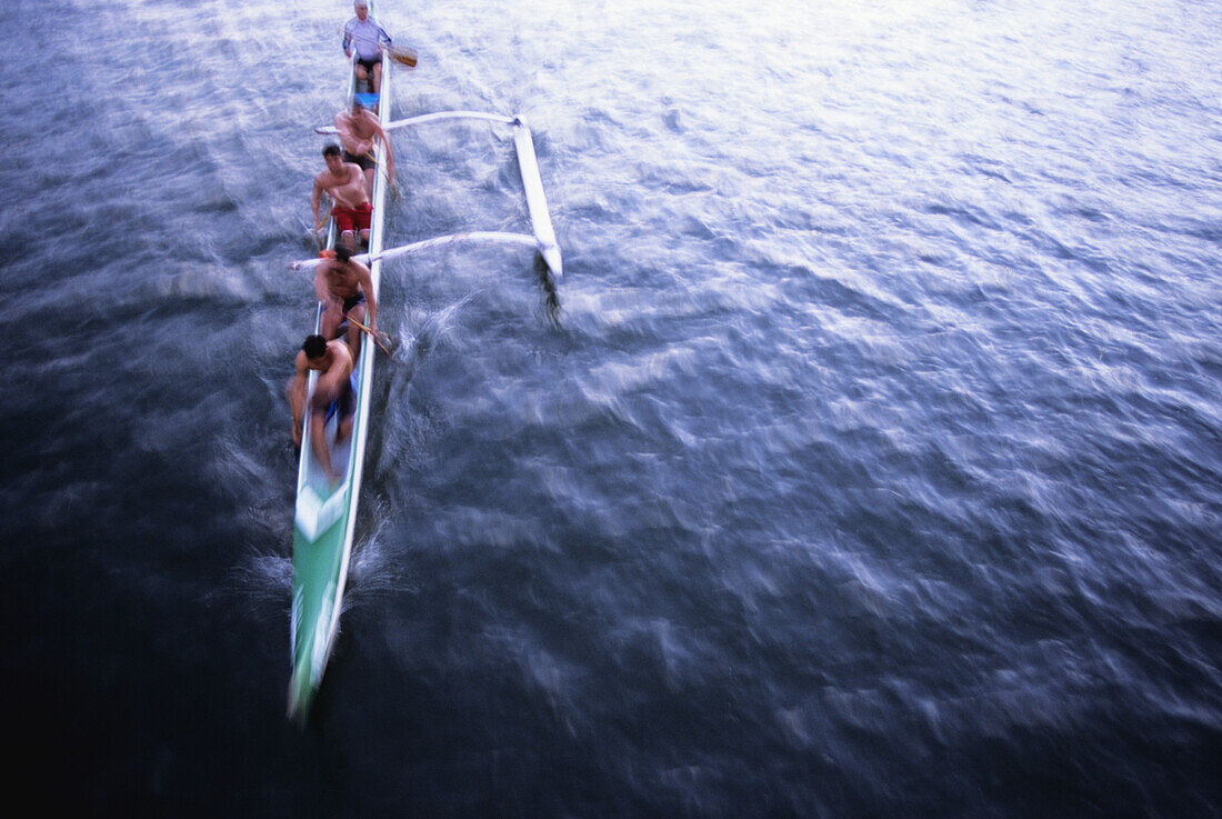 Hawaii, Oahu, Ala Wai Canal, Men paddling an outrigger canoe, motion blur, view from above NO MODEL RELEASE