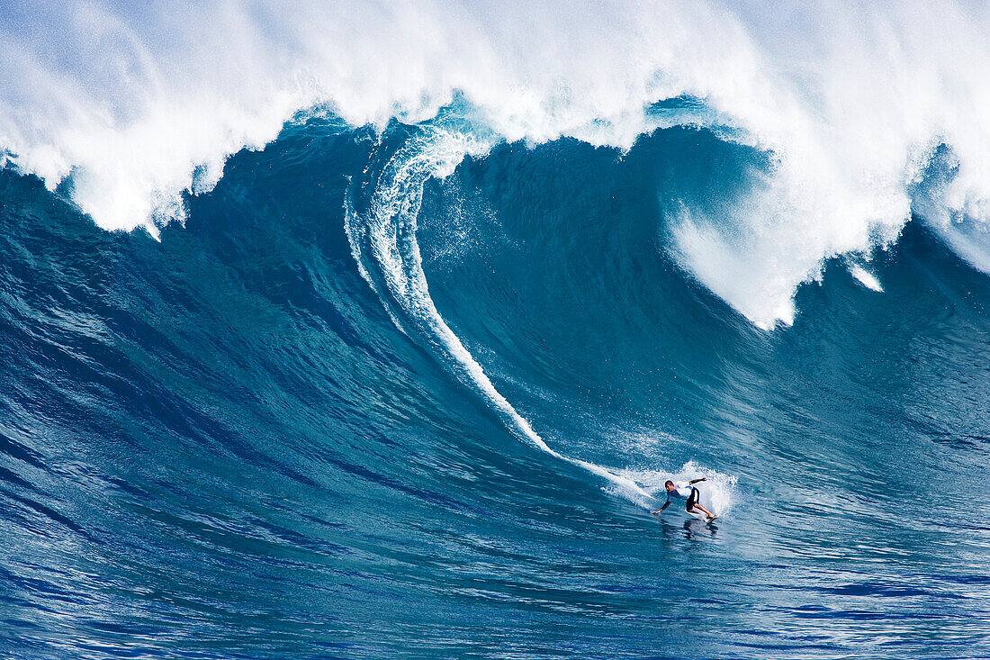 Hawaii, Maui, Jorge Martinez surfs huge wave at Jaws aka Peahi.