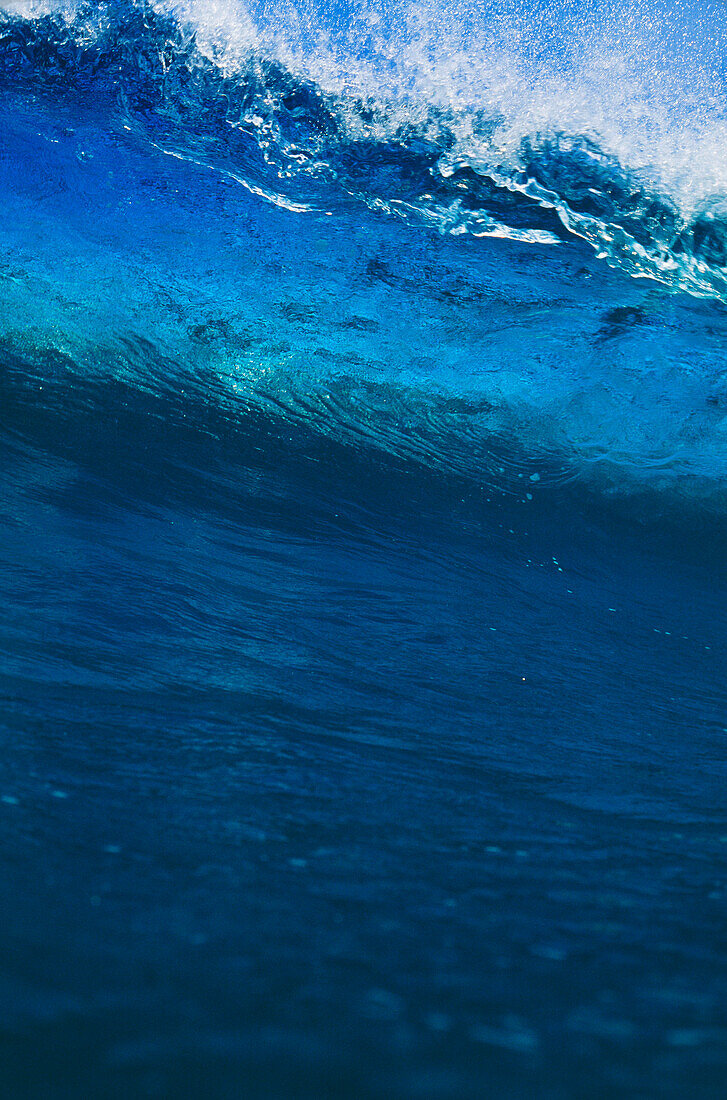Hawaii, Big blue wave begins to crash.