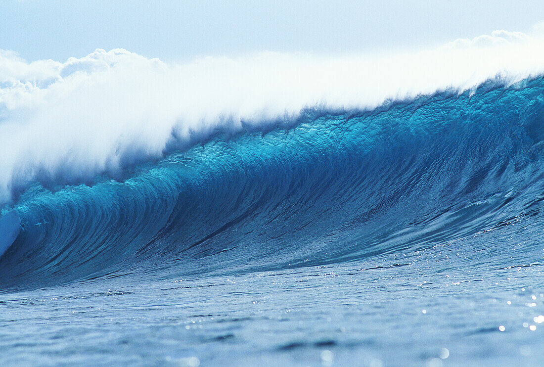 Blue wave curling over.