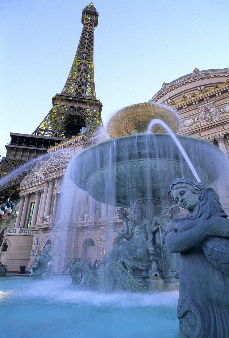 Nevada, Las Vegas, Paris Hotel and Casino, Eiffel Tower replica rises above a facade of French buildings and fountains