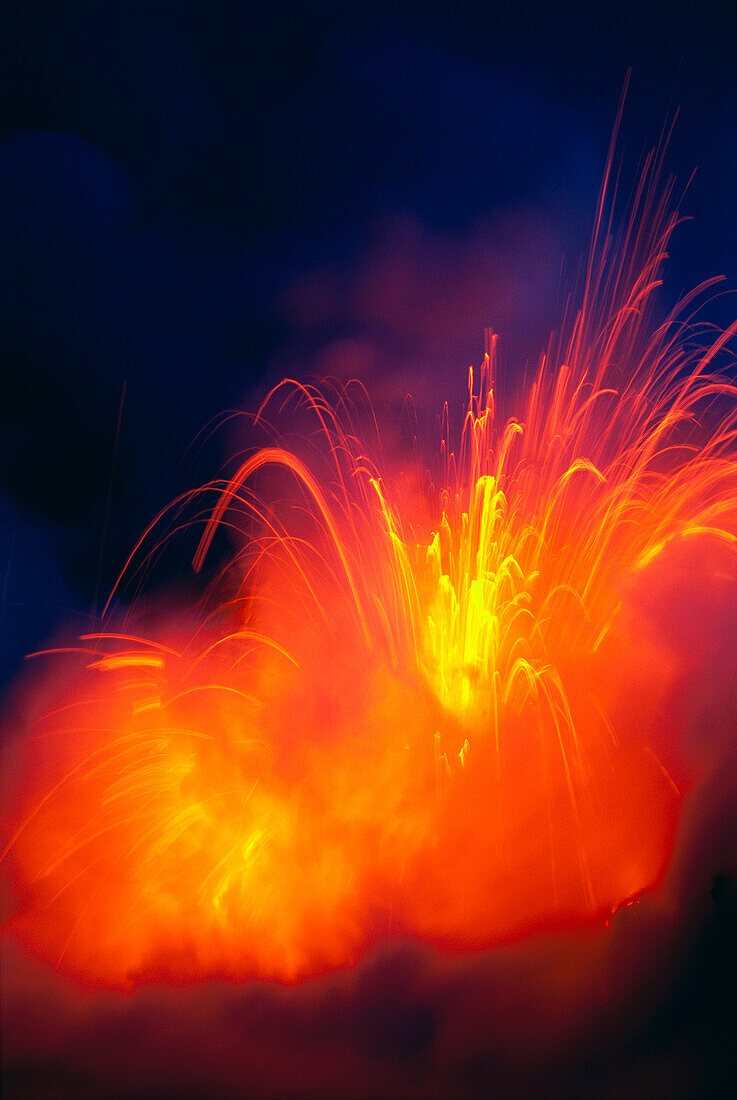 Hawaii, Big Island, Hawaii Volcanoes National Park, lava exploding as flow hits ocean, nighttime A28G