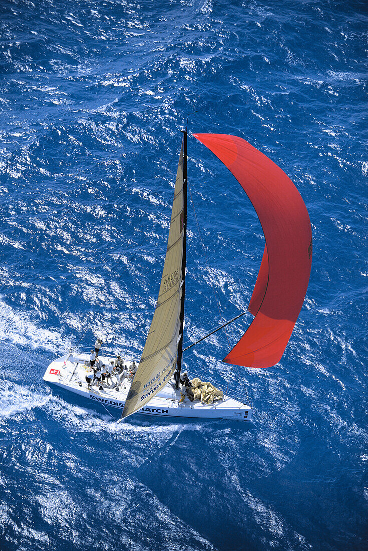 Florida, Miami, Short Ocean Racing Championship (SORC), Aerial view of yacht with sails blowing in wind, cutting through water