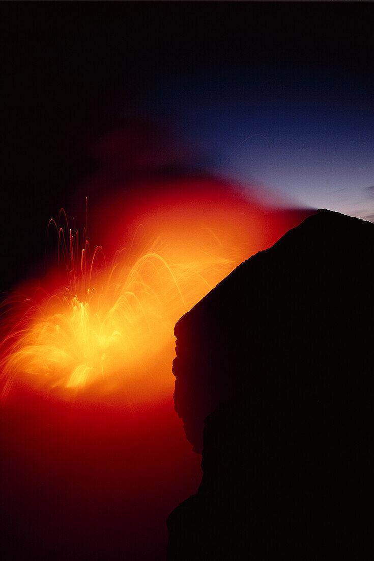 Hawaii, Big Island, Kilauea volcano meets the sea, explosive reaction at twilight
