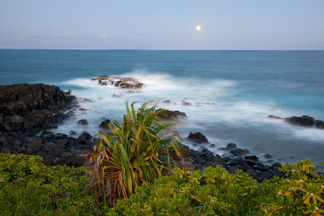 Hawaii, Maui, Hana, The moon rising over soft ocean.