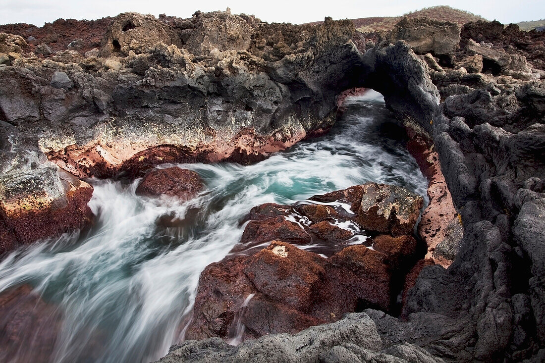 Hawaii, Maui, Makena, Ocean water moving through a lava tube.