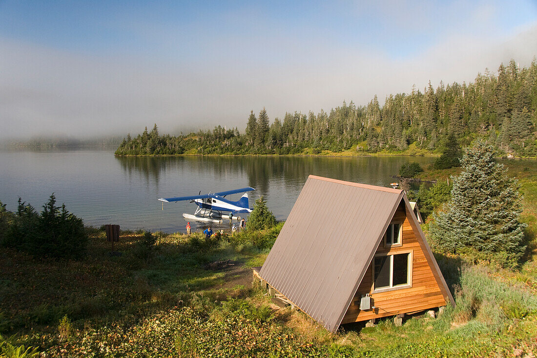 USA, Alaska, Prince William Sound, Shrode Lake, float plane parked by US Forest Service cabin.