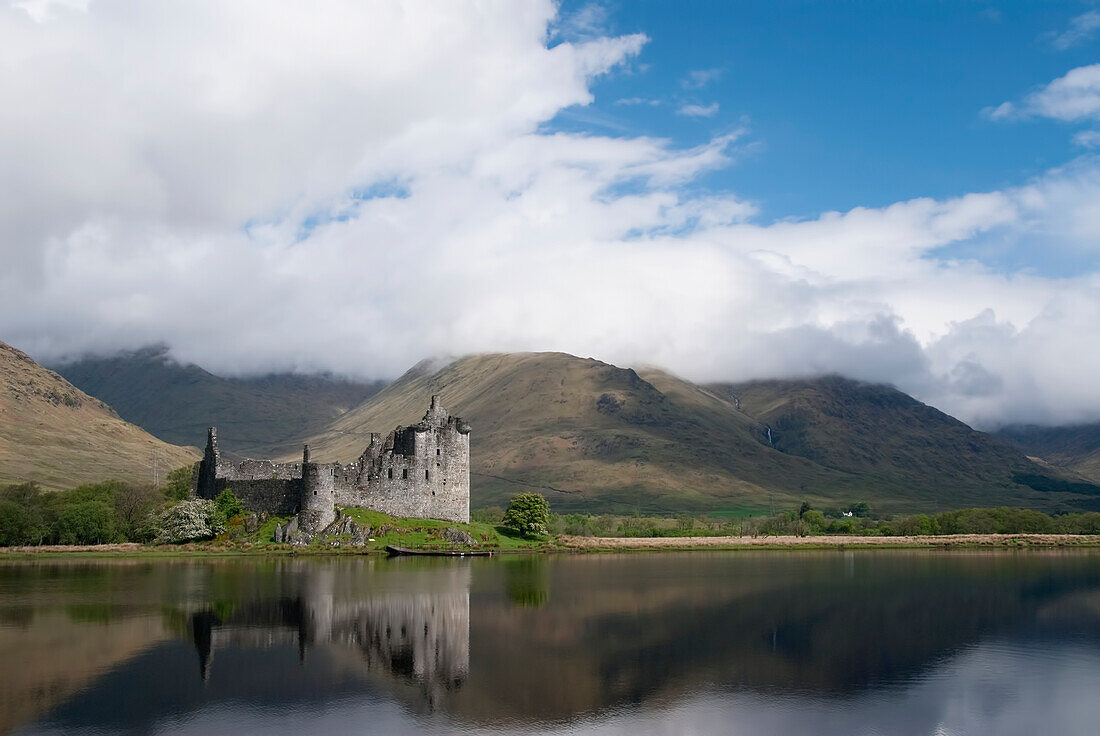 United Kingdom, Scotland, Kilcurn Castle on a peninsula at the end of Loch Awe, Castle reflecting in water.