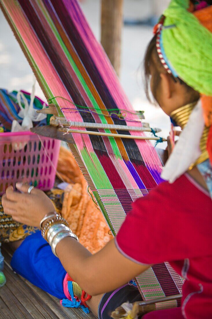 'Girl Weaving Brightly Colored Threads; Chiang Mai, Thailand'