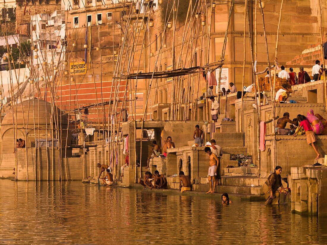'The Ganges, Varanasi, India;People Bathing And Relaxing In And Around The River'