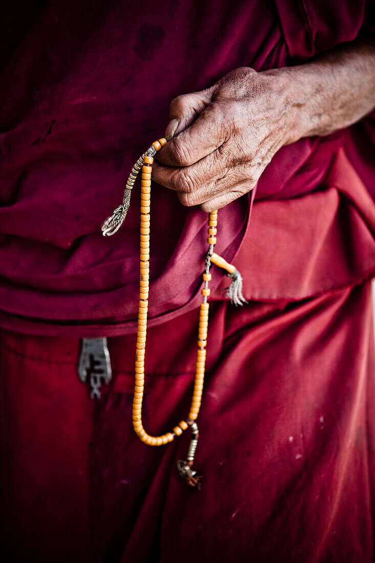 'An Old Buddhist Monk Counts Prayer Beads; Ladakh Jammu And Kashmir India'