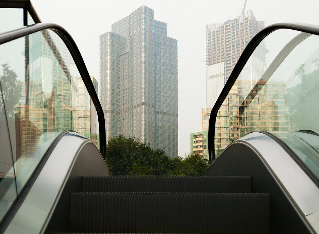 An escalator leading to a construction site of apartments in the Central Business District of Beijing., Beijing street escalator