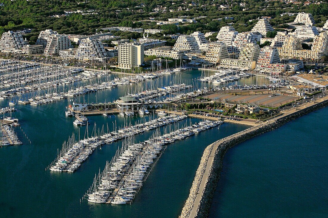 France, Hérault (34), La Grande Motte seaside resort, and large marina in the Mediterranean (aerial photo)