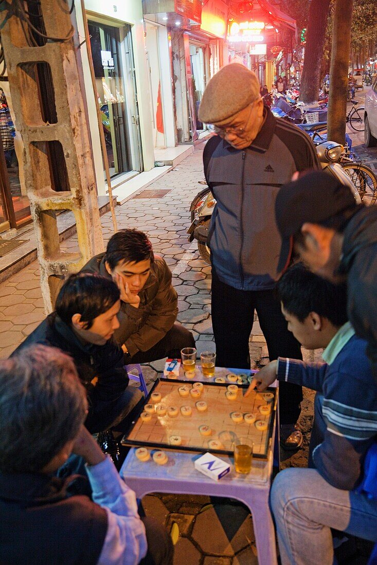 Vietnam,Hanoi,People Playing Checkers on Sidewalk