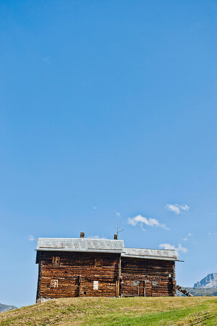 Wooden house, Alpine hut in the Alps, Livigno, Lombardy, Italy