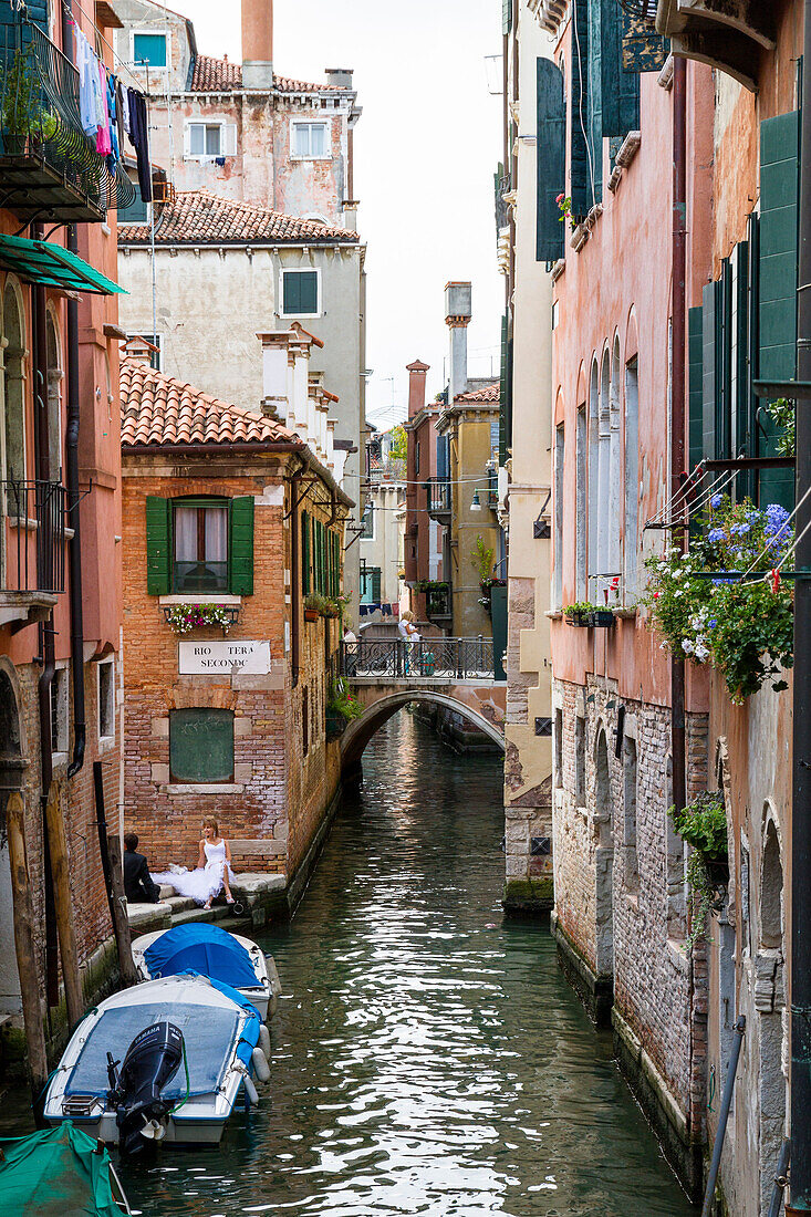 Canal and boats in the city of Venice, Venetia, Italy, Europe