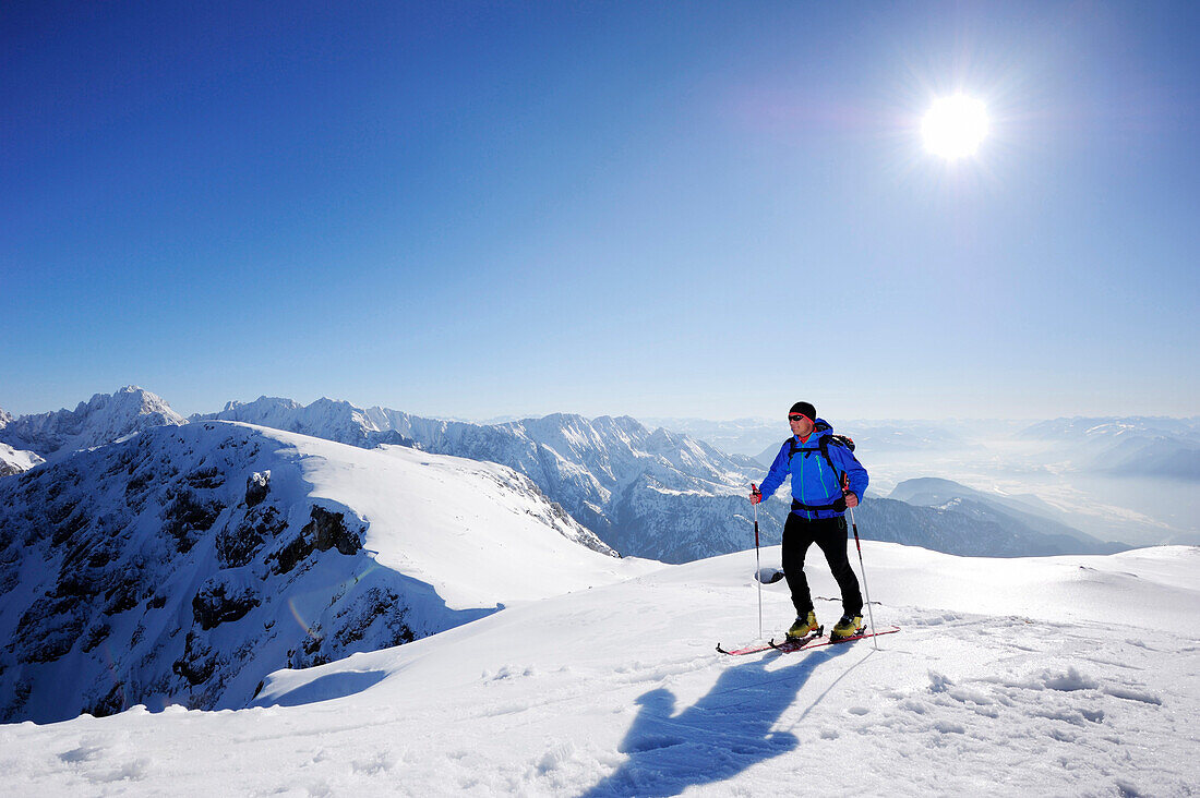 Backcountry skier ascending to Pyramidenspitze, Kaiser-Express, Zahmer Kaiser, Kaiser mountain range, Tyrol, Austria