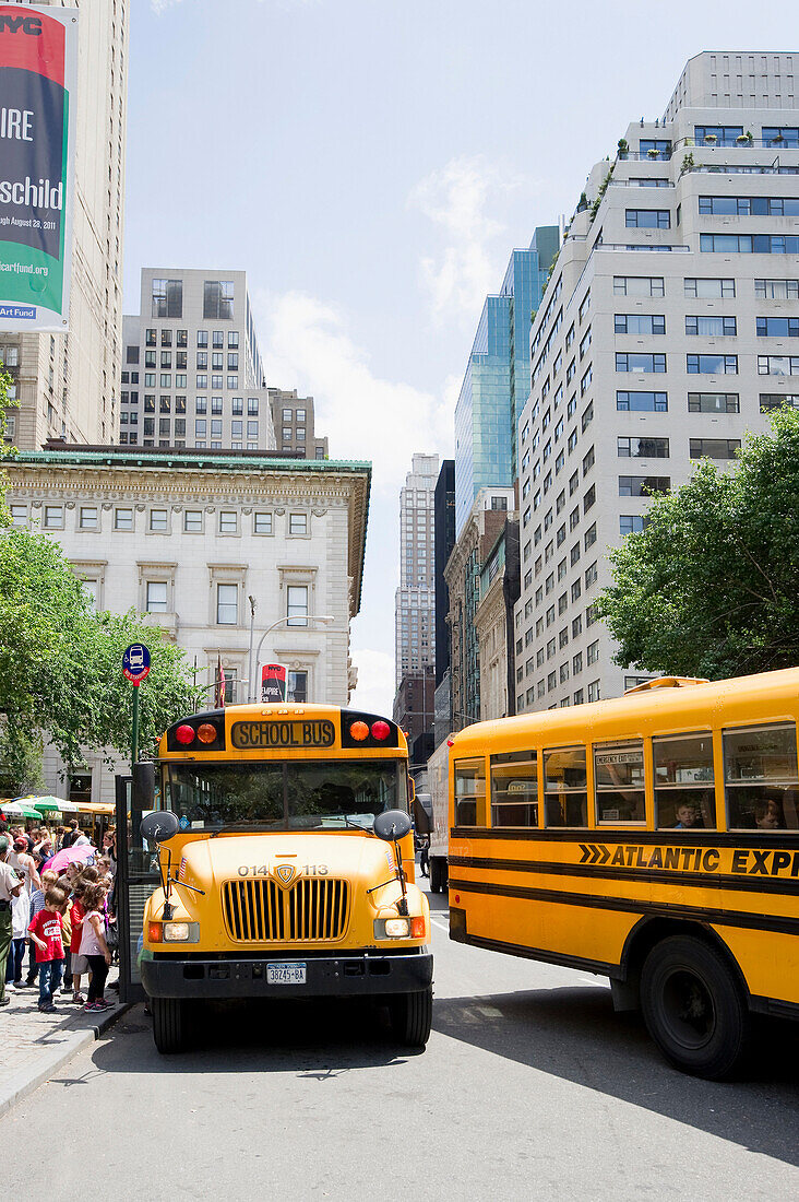 School buses near Central Park, Manhattan, New York, USA