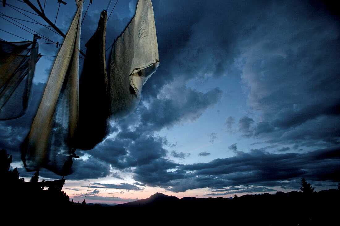 Clothesline in the mountains while a sunset, Oberberg, Bavaria, Germany