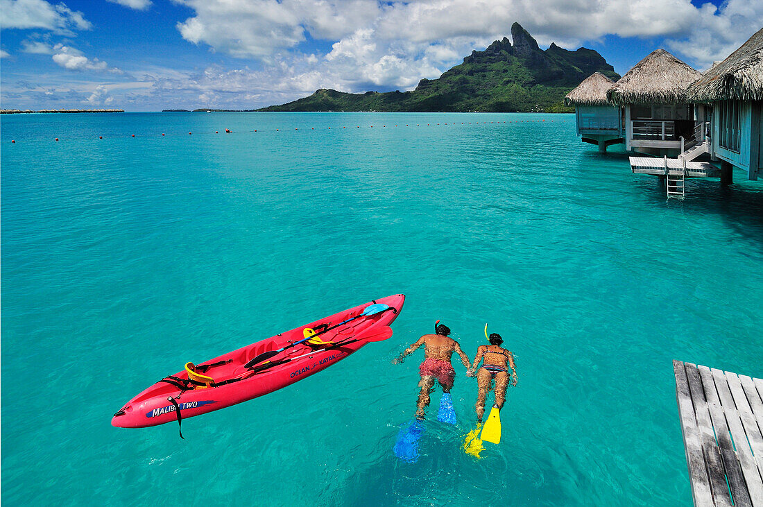 Couple snorkelling, Saint Regis Bora Bora Resort, Bora Bora, Society Islands, French Polynesia, Windward Islands, South Pacific