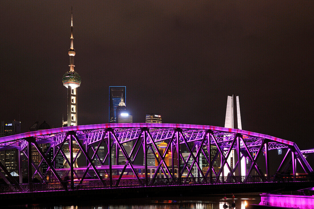 Waibaidu Bridge at night, Oriental Pearl Tower, Bund Skyline along the Huangpu River, Shanghai, China