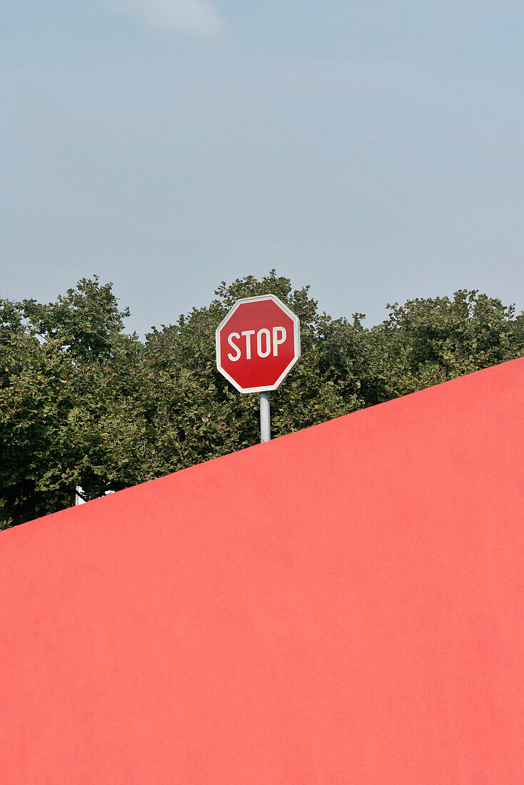 Stop sign behind modern architecture, grafical, gymnasium Podcetrtek close to Terme Olimia, Stajerska, Koroska, Slovenia