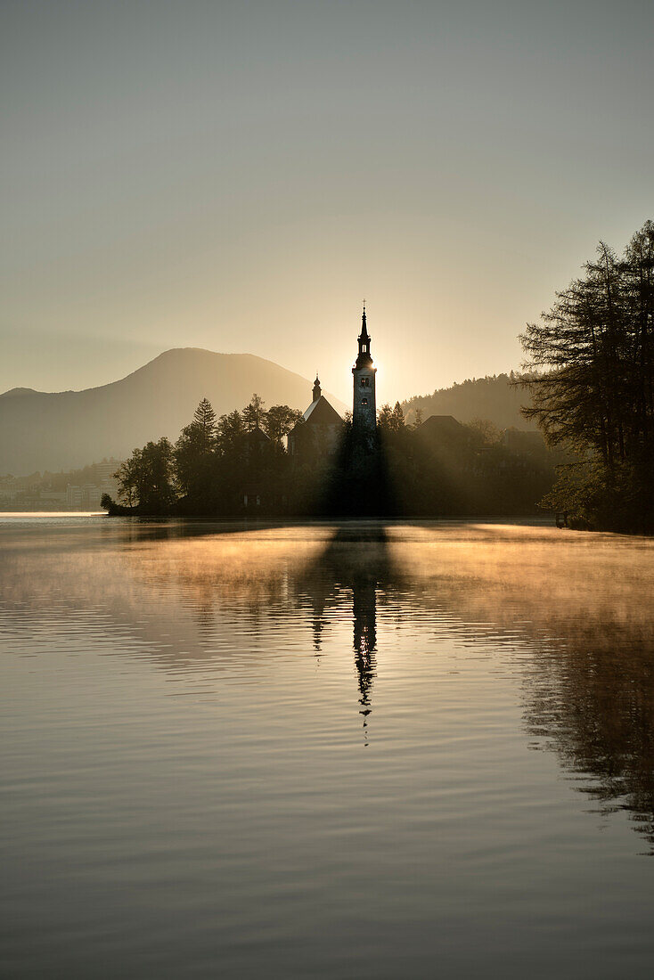 View at St Mary Church in early morning at tiny island of Lake Bled, Julian Alps, Gorenjska, Slovenia
