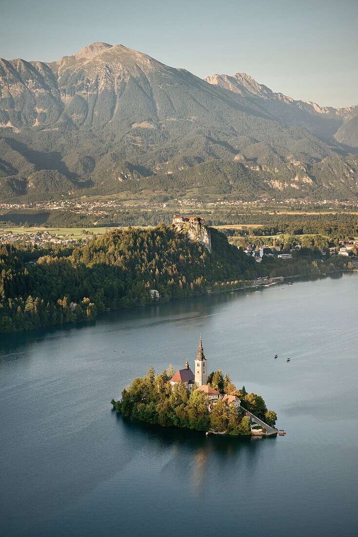 View at St Mary Church at tiny island of Lake Bled, castle, mountains, Osojnica viewpoint, Julian Alps, Gorenjska, Slovenia