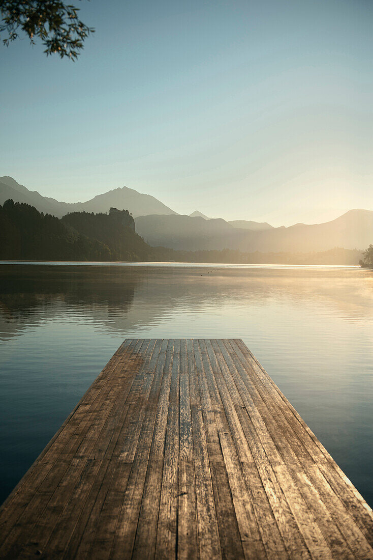 View at castle at Lake Bled, jetty, mist, steam, Julian Alps, Gorenjska, Slovenia