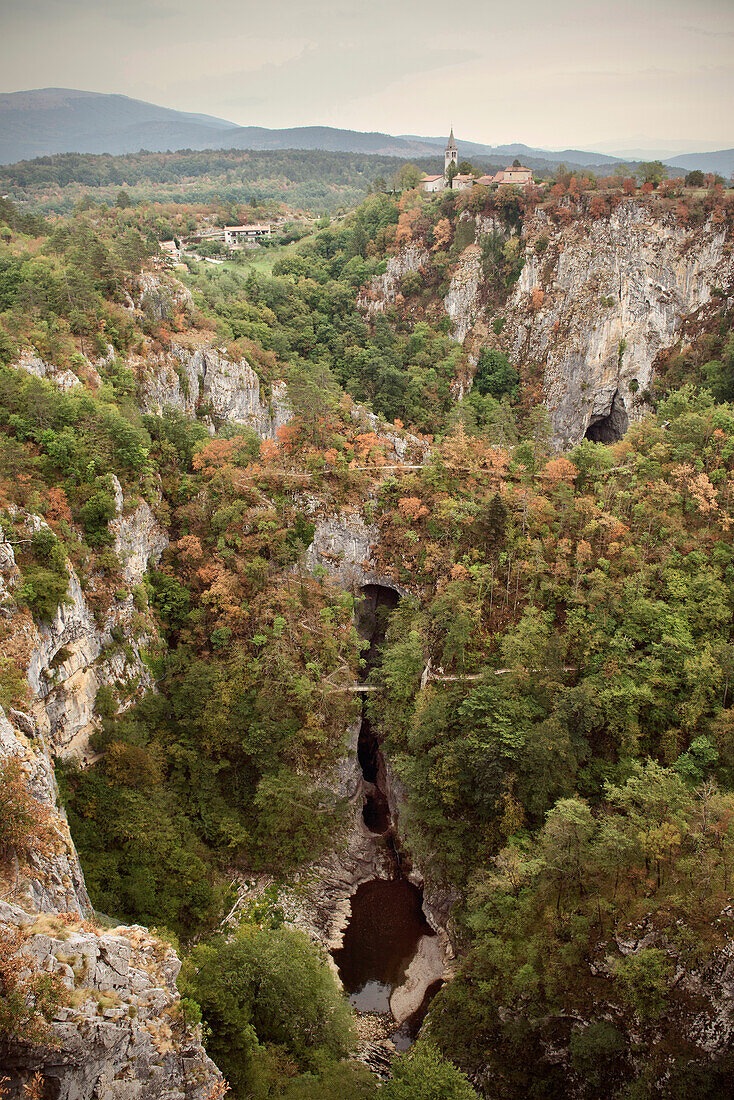 View at Skocjan caves,  UNESCO world heritage, church and village, autumn, Notranjska, Slovenia