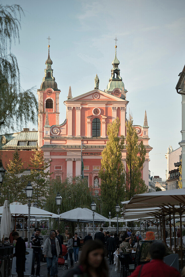 View at Franciscan church of the annunciation, lively inner city impression of capital Ljubljana, Slovenia