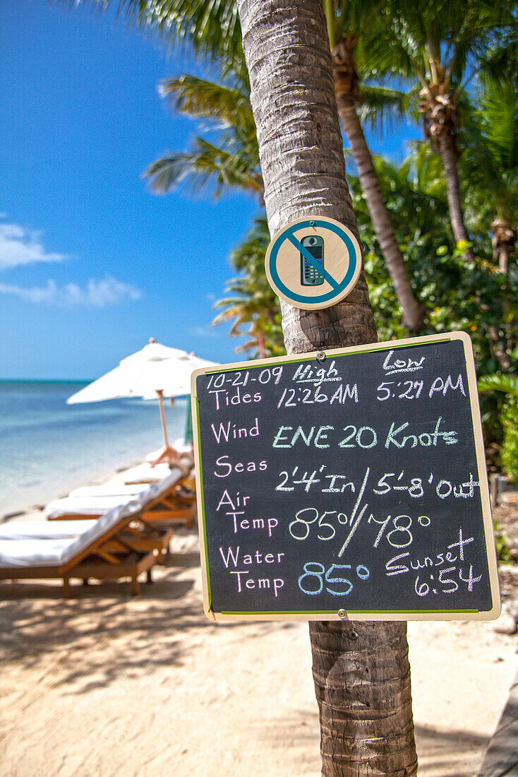Board with weather forecast of the day, Little Palm Island Resort, Florida Keys, USA