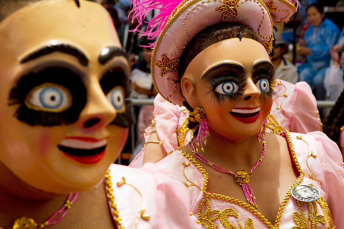 Morenada dancers wearing masks in the procession of the Carnaval de Oruro, Oruro, Bolivia