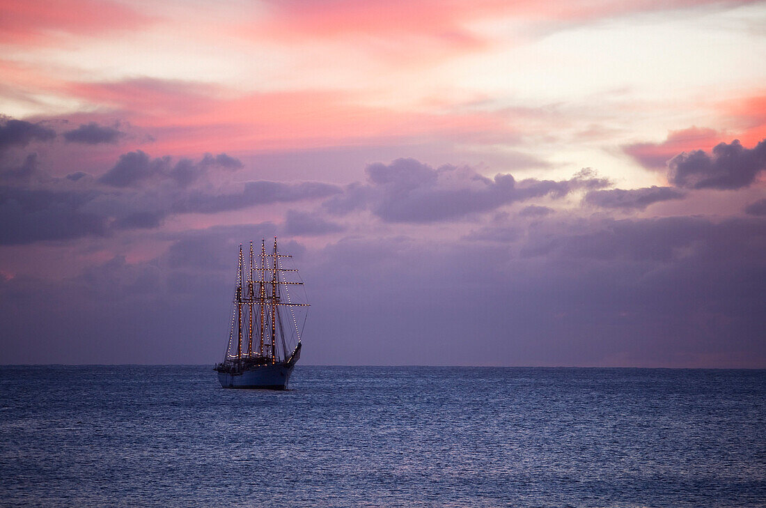 The four-mast barquentine, Esmeralda that is the Chilean Navy Training Ship in Hanga Roa Harbour at dusk, Rapa Nui (Easter Island), Chile