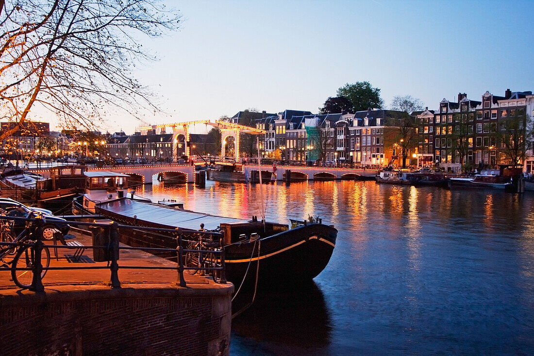 Magere Brug over the Amstel river at night, Amsterdam, Netherlands