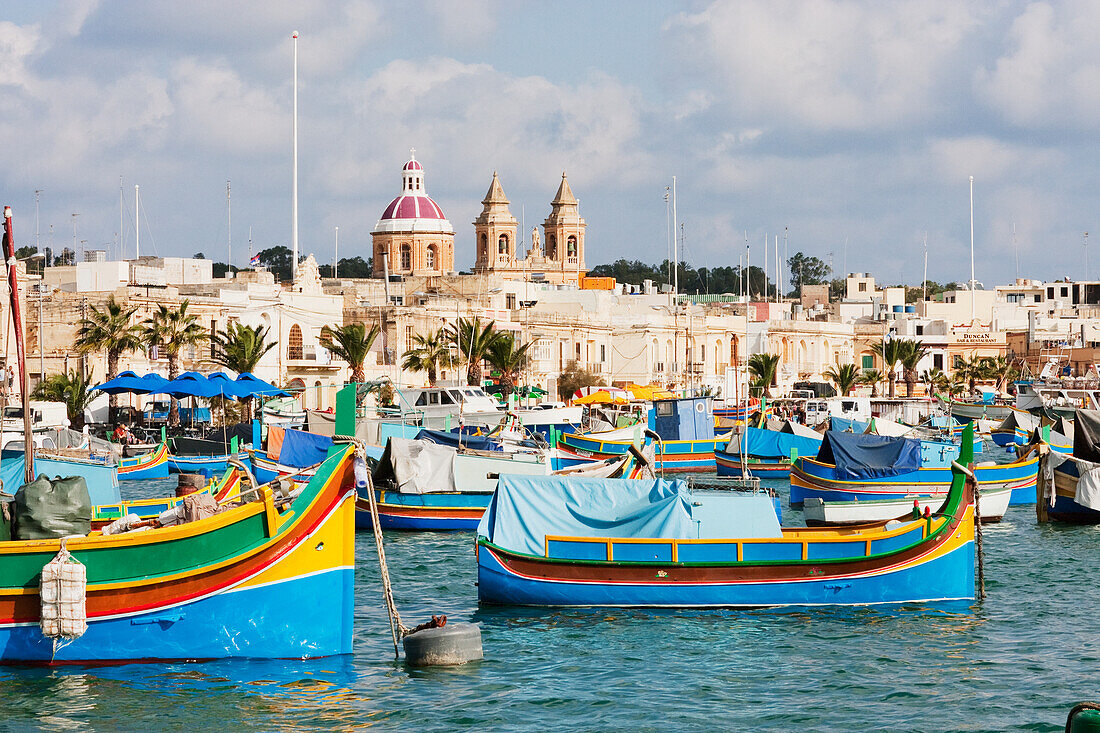 Luzzus, traditional Maltese fishing boats in the harbour, Marsaxlokk, Malta