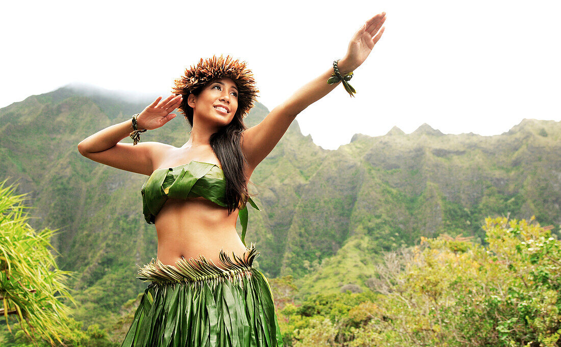 Hawaii, Oahu, Local Hawaiian Female doing a Kahiko Hula Dance.