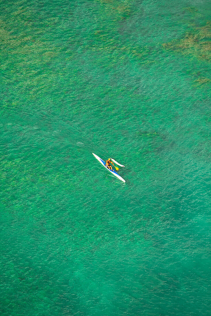 Hawaii, Oahu, Waikiki, Aerial view of local man in an Outrigger Canoe. (EDITORIAL USE ONLY)