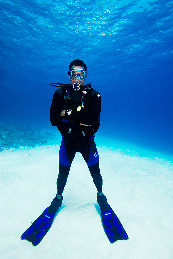 Micronesia, Palua, Divers standing on a sand bottom.