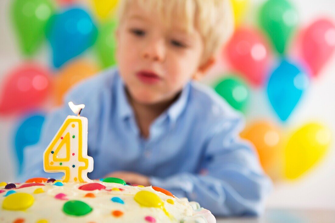 Four year old boy celebrating his birthday