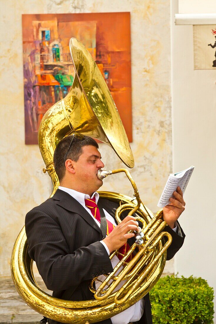 A tuba player of the Minori Concert Band entertaining in the village square in Ravello, Italy